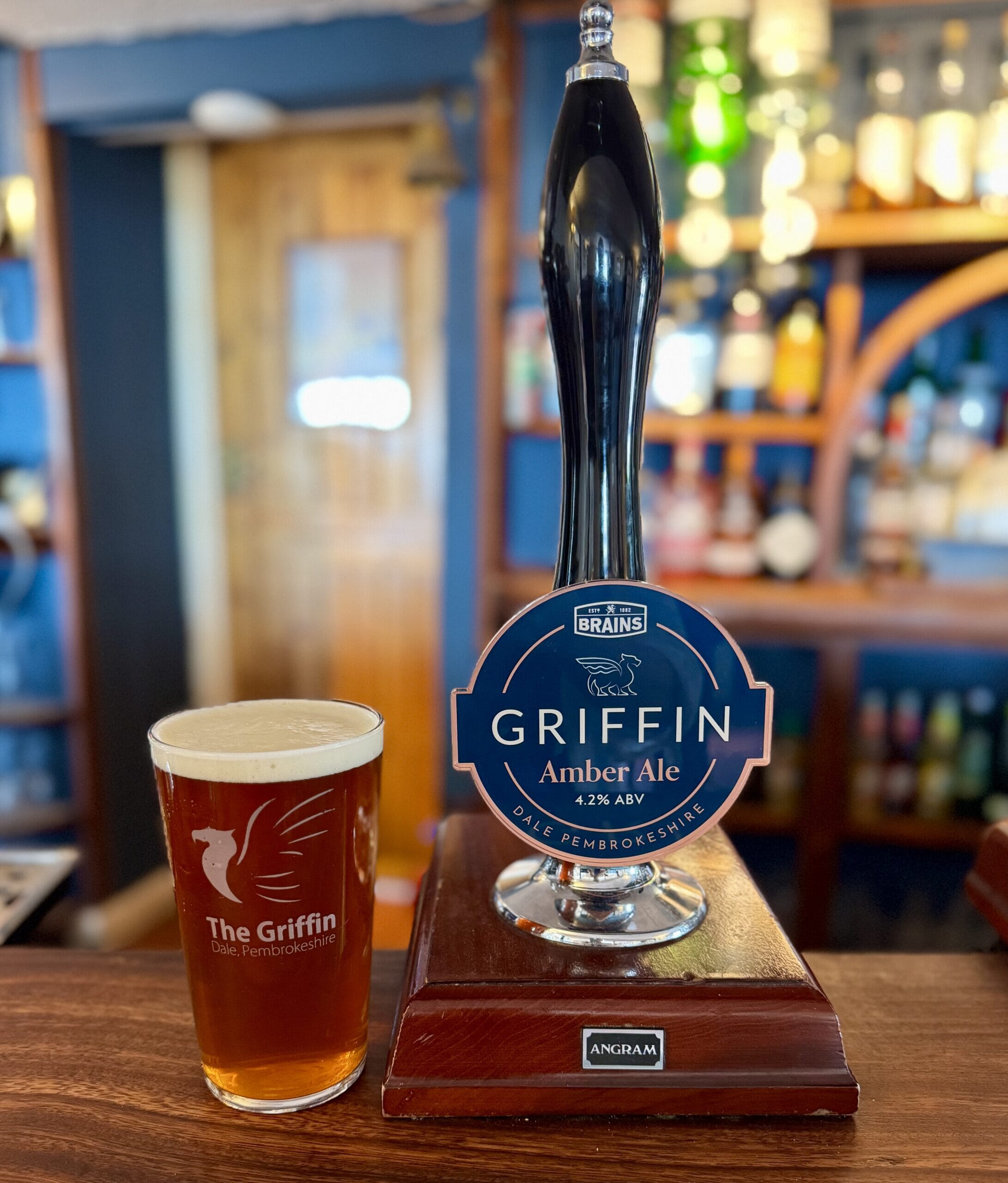 Pint of Griffin Ale, a smooth amber ale with toasted malt and caramel notes, brewed exclusively for The Griffin pub in Pembrokeshire